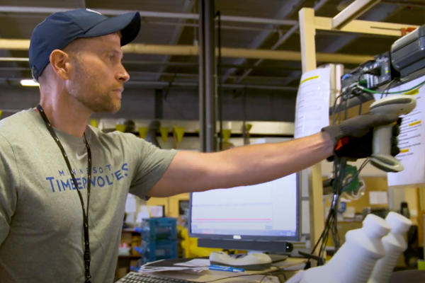 general stores employee scanning a bar code