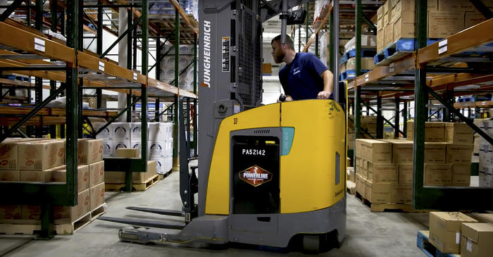 Warehouse employee on a forklift